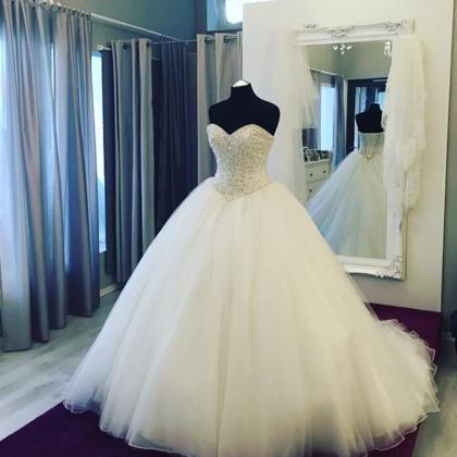 Sleeveless Ball Gown Wedding Dress With Pearls..